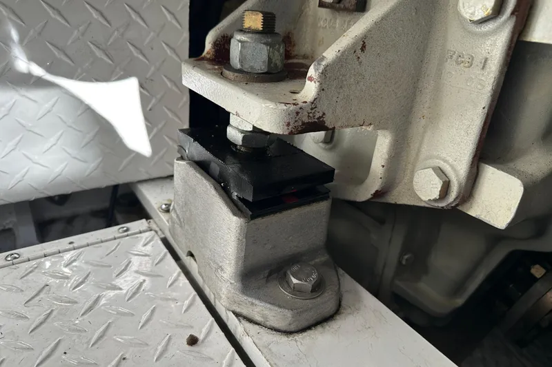 Slide: The Image of Engine mount detail of a 2004 Formula 48 Yacht, showing bolts and metal components. - 73