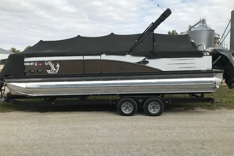 Slide: The Image of 2019 Avalon Catalina VRL 25' pontoon boat on trailer, covered with black tarp. - 10
