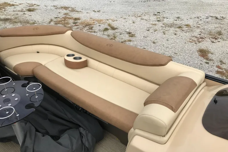 Slide: The Image of Luxurious seating on 2019 Avalon Catalina VRL 25' boat with cup holders and table. - 13