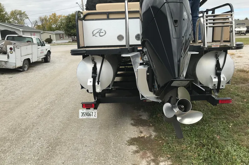 Slide: The Image of Rear view of a 2019 Avalon Catalina VRL 25' boat with outboard motor. - 4