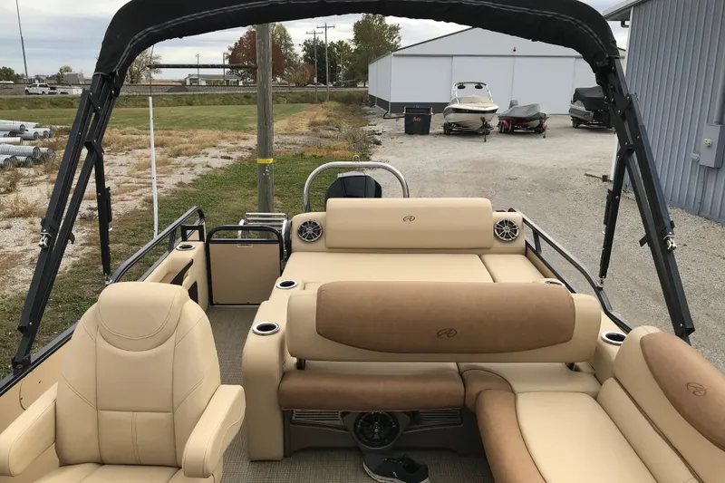 Slide: The Image of 2019 Avalon Catalina VRL 25' pontoon boat interior with beige seating and cup holders. - 7