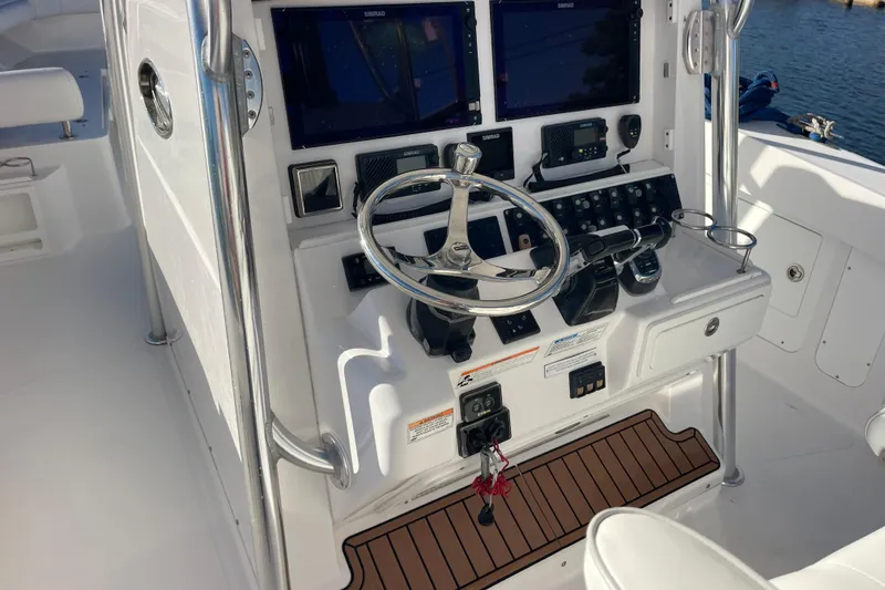 Slide: The Image of 2018 Southport 33 FE boat helm with dual screens and controls. - 10