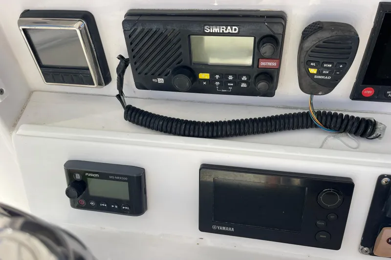 Slide: The Image of Control panel of a 2018 Southport 33 FE boat with Simrad and Yamaha electronics. - 14