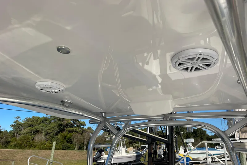 Slide: The Image of 2018 Southport 33 FE boat interior with speakers and metal framework. - 19