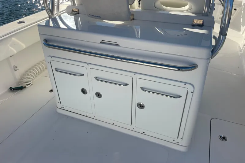 Slide: The Image of 2018 Southport 33 FE boat interior with storage compartments and sleek design. - 22