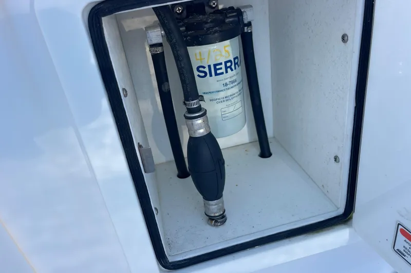 Slide: The Image of Fuel filter system in a 2018 Southport 33 FE boat compartment. - 27