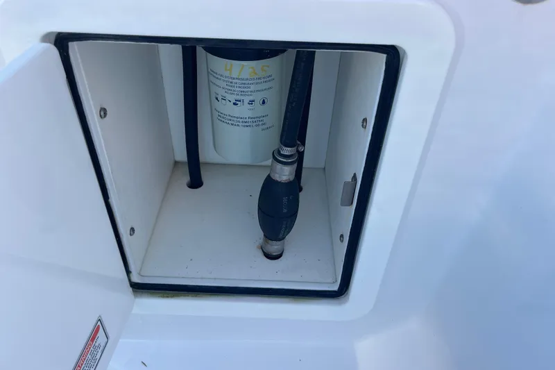 Slide: The Image of Compartment of 2018 Southport 33 FE boat showing fuel system components. - 28