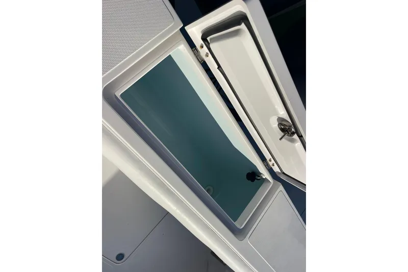Slide: The Image of Open storage compartment on a 2018 Southport 33 FE boat. - 30