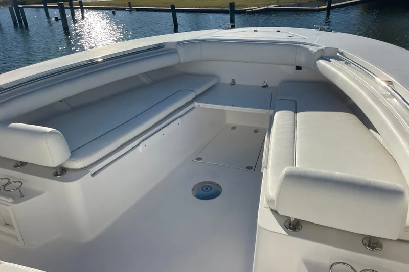 Slide: The Image of 2018 Southport 33 FE boat interior with white seating and open deck. - 35