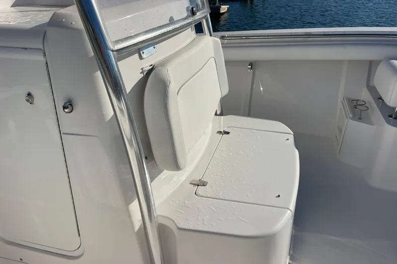 Slide: The Image of 2018 Southport 33 FE boat interior with white seating and stainless steel railing. - 36