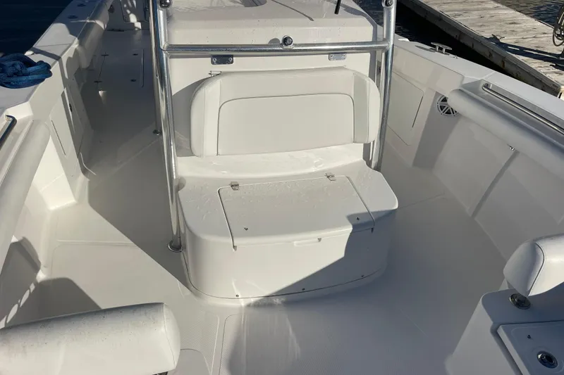 Slide: The Image of 2018 Southport 33 FE boat interior with white seating and storage compartment. - 38