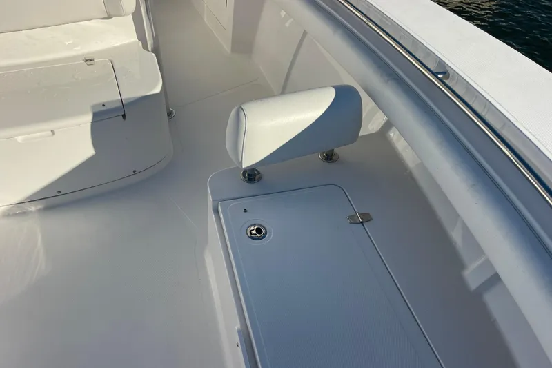 Slide: The Image of 2018 Southport 33 FE boat deck with seating and storage compartment. - 40