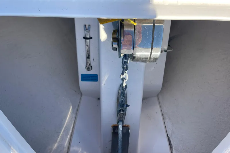 Slide: The Image of Anchor chain and wrench in a 2018 Southport 33 FE boat compartment. - 49