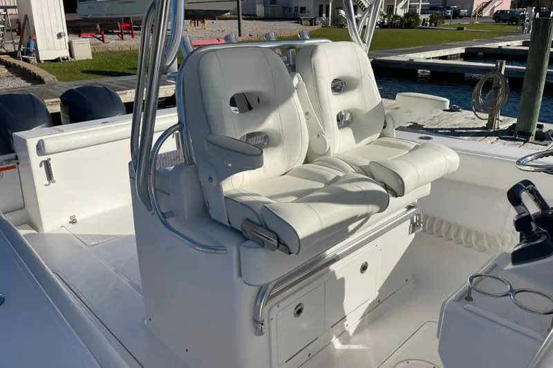 Slide: The Image of 2018 Southport 33 FE boat with white leather seating and dual outboard motors. - 7