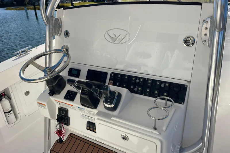 Slide: The Image of 2018 Southport 33 FE boat helm with steering wheel and control panel. - 8