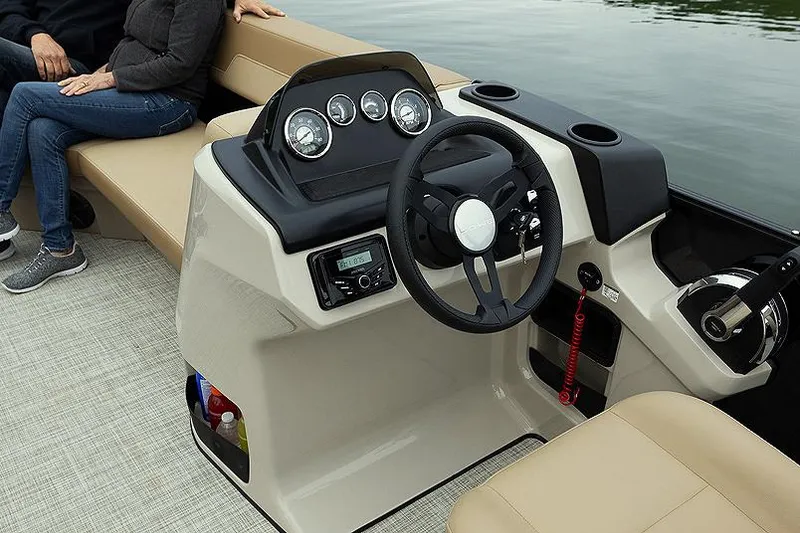 Slide: The Image of Manufacturer Provided Image: 2025 Lowe LS 170 boat interior with steering wheel and dashboard controls. - 2