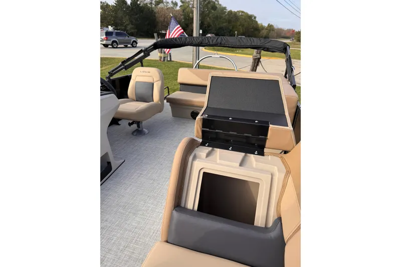 Slide: The Image of 2026 Lowe LS 170 boat interior with beige seating and storage compartments. - 6