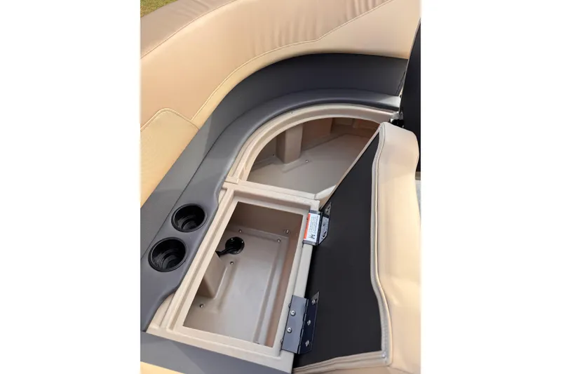 Slide: The Image of 2026 Lowe LS 170 boat seat storage with cup holders and beige upholstery. - 7