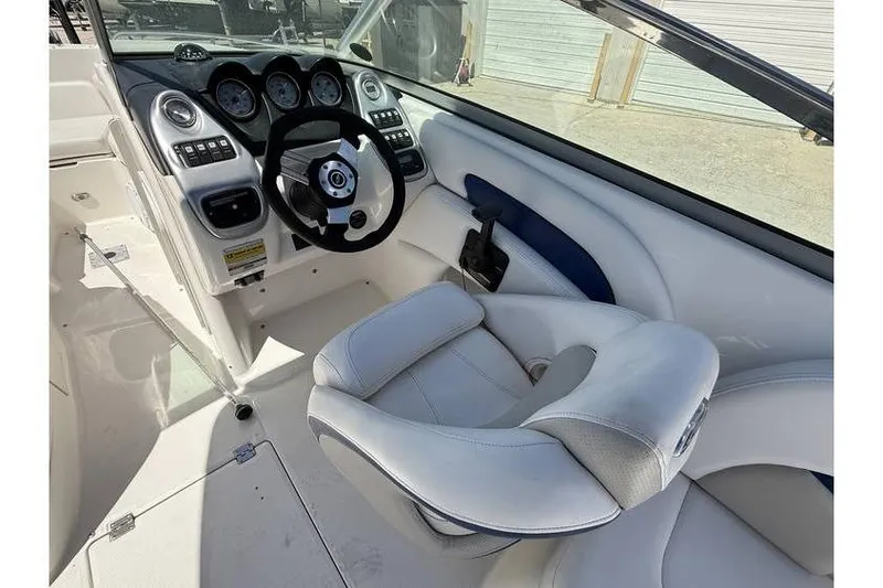 Slide: The Image of 2007 Chaparral 236 SSX boat cockpit with steering wheel and control panel. - 5