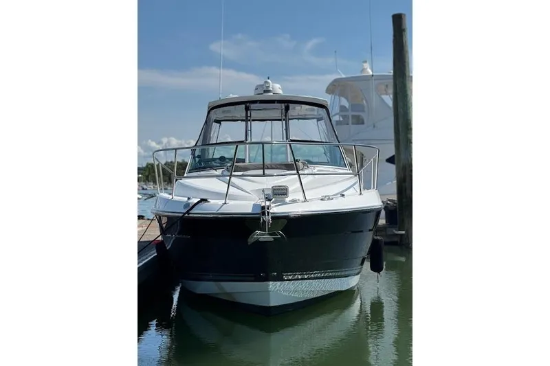 Slide: The Image of 2021 Monterey 335 Sport Yacht docked in marina, front view. - 10