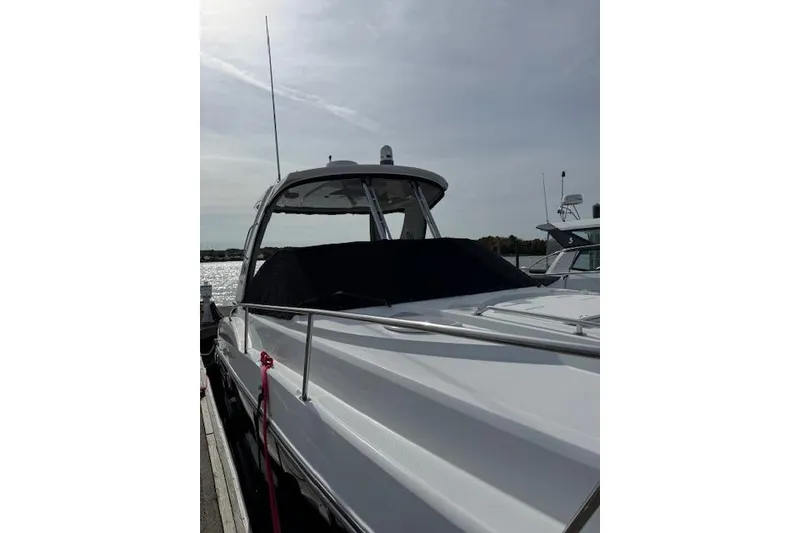 Slide: The Image of 2021 Monterey 335 Sport Yacht docked, showcasing sleek design and modern features. - 13