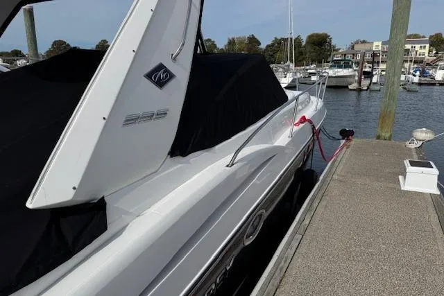Slide: The Image of 2021 Monterey 335 Sport Yacht docked at a marina, covered and secured. - 15