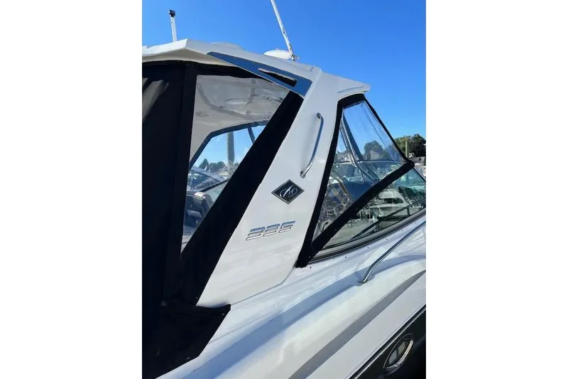 Slide: The Image of 2021 Monterey 335 Sport Yacht, sleek design, side view, docked under clear blue sky. - 16