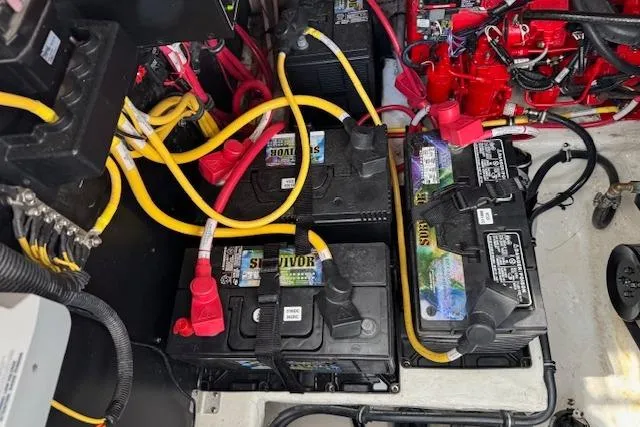 Slide: The Image of Battery compartment of a 2021 Monterey 335 Sport Yacht with cables and connections. - 20