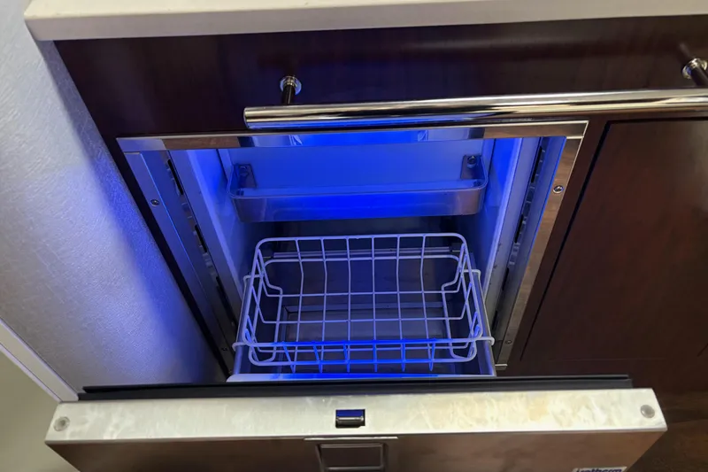 Slide: The Image of Open drawer with blue-lit interior on 2021 Monterey 335 Sport Yacht. - 26