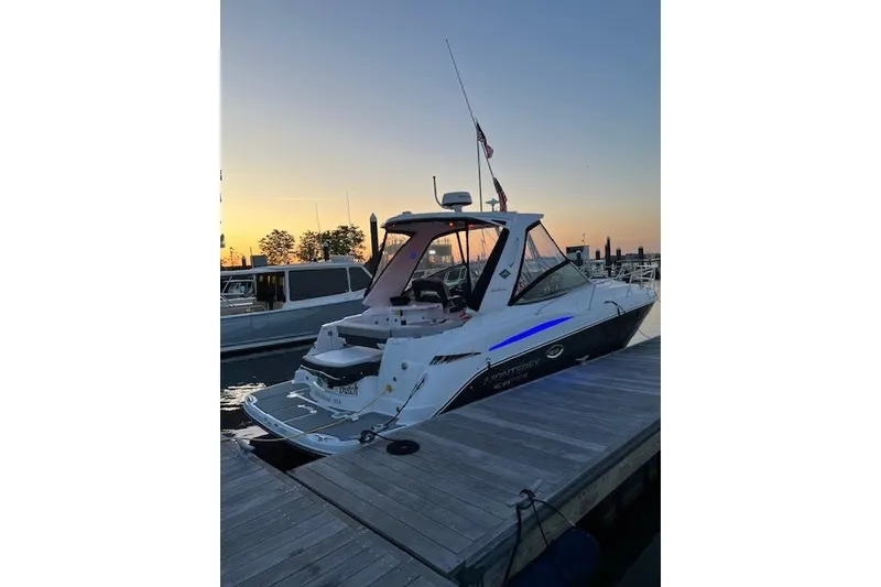 Slide: The Image of 2021 Monterey 335 Sport Yacht docked at sunset, showcasing sleek design and modern features. - 3