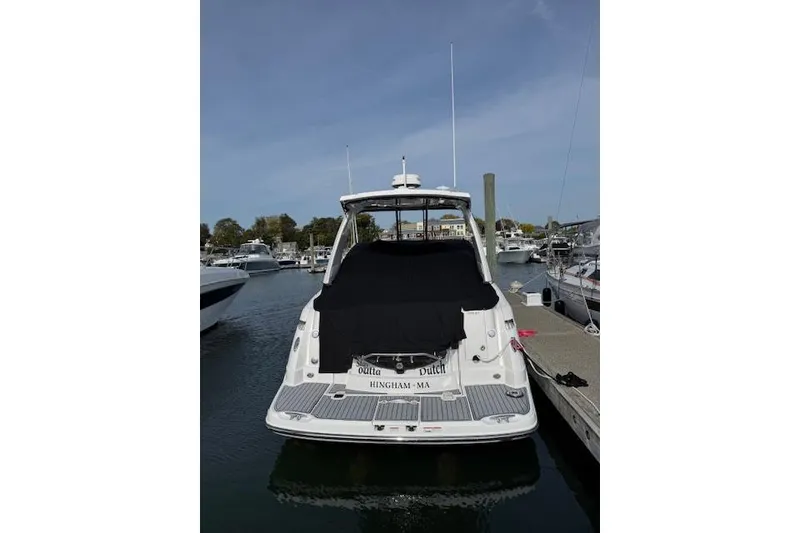Slide: The Image of 2021 Monterey 335 Sport Yacht docked at marina, rear view. - 4