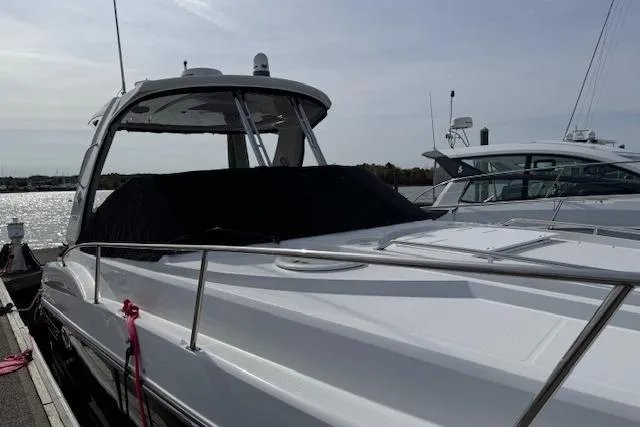 Slide: The Image of 2021 Monterey 335 Sport Yacht docked, showcasing sleek design and modern features. - 6