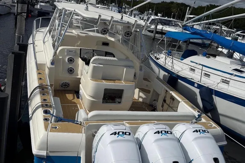 Slide: The Image of 2006 Intrepid 377 boat with triple 400R engines docked at marina. - 22