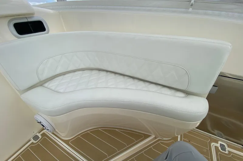 Slide: The Image of Luxurious seating on a 2006 Intrepid 377 boat with quilted white upholstery. - 26