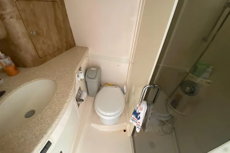 Slide: The Image of Bathroom interior of a 2006 Intrepid 377 boat with shower and sink. - 40