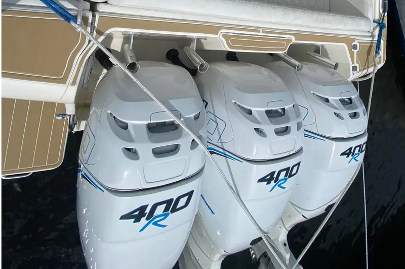 Slide: The Image of Triple 400R outboard engines on a 2006 Intrepid 377 boat, docked. - 44