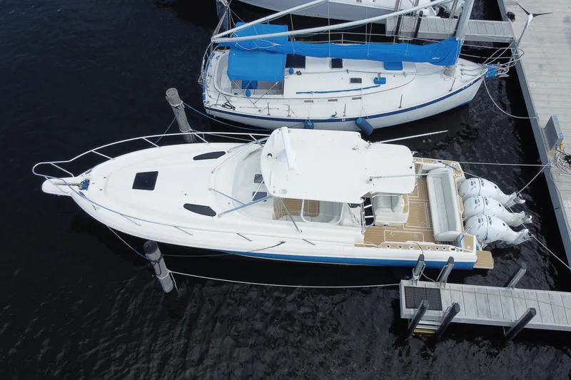 Slide: The Image of Aerial view of 2006 Intrepid 377 boat docked beside a sailboat. - 45
