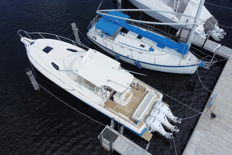 Slide: The Image of Aerial view of 2006 Intrepid 377 boat docked alongside a sailboat. - 48