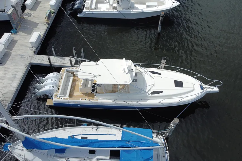 Slide: The Image of Aerial view of a 2006 Intrepid 377 boat docked at a marina. - 50
