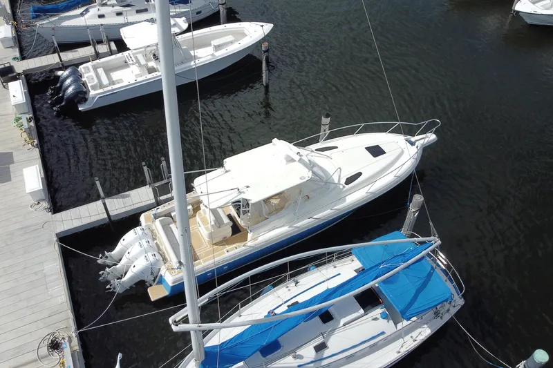 Slide: The Image of Aerial view of a 2006 Intrepid 377 boat docked at a marina. - 51