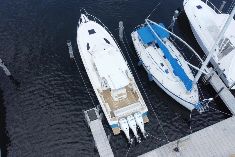 Slide: The Image of Aerial view of 2006 Intrepid 377 boat docked alongside sailboats. - 52
