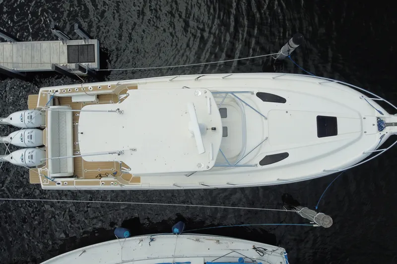 Slide: The Image of Top view of a 2006 Intrepid 377 boat docked at a marina. - 53