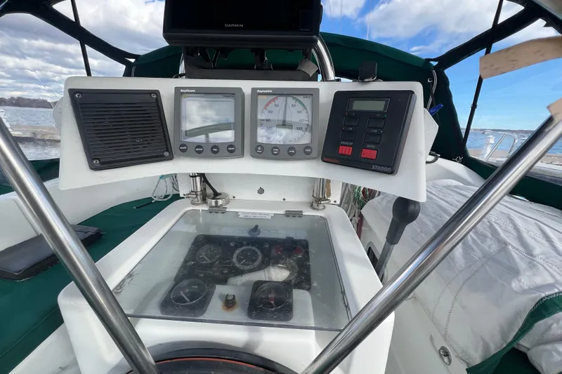 Slide: The Image of Cockpit of 1994 Beneteau Oceanis 351 sailboat with navigation instruments and controls. - 10