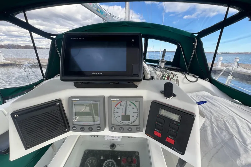 Slide: The Image of Cockpit of 1994 Beneteau Oceanis 351 sailboat with navigation instruments and Garmin GPS. - 11