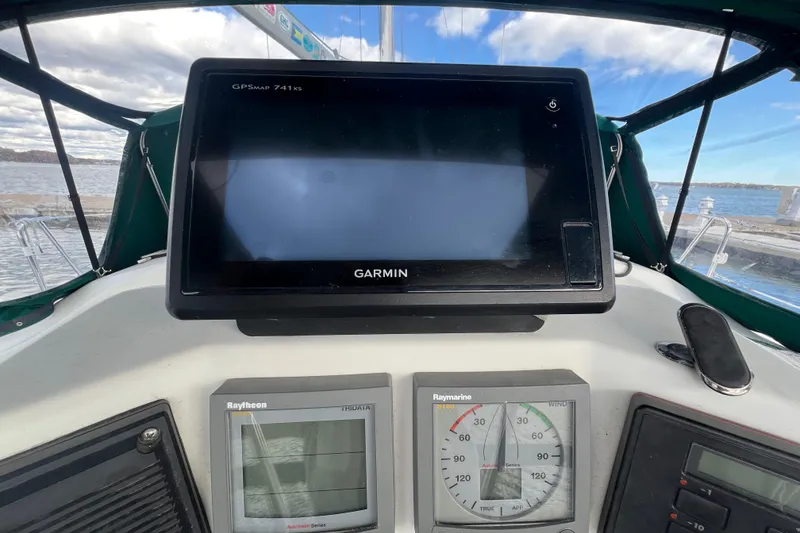 Slide: The Image of Cockpit of 1994 Beneteau Oceanis 351 with Garmin GPS and Raytheon instruments. - 13