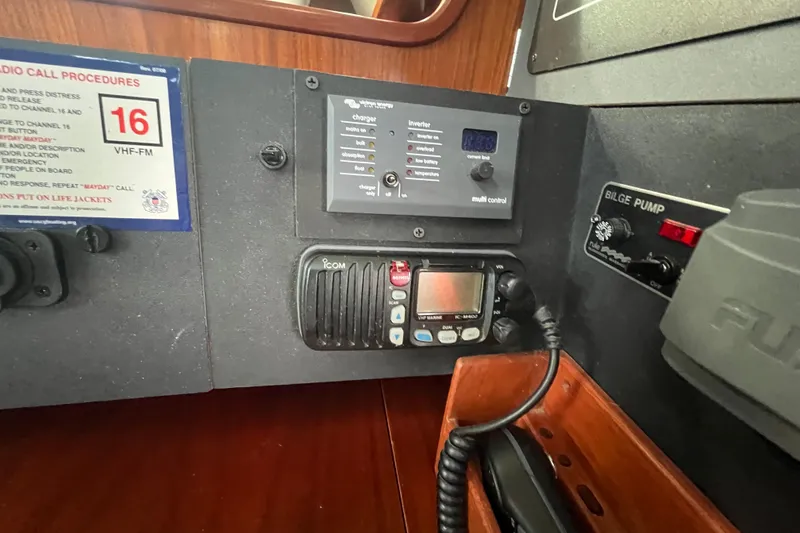 Slide: The Image of Control panel of a 1994 Beneteau Oceanis 351 sailboat with radio and bilge pump. - 17