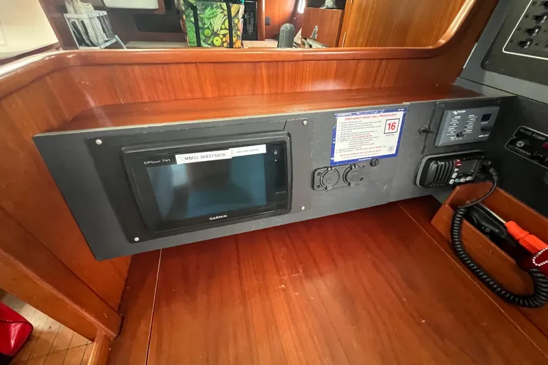 Slide: The Image of Navigation panel of 1994 Beneteau Oceanis 351 sailboat with Garmin GPS and radio equipment. - 19