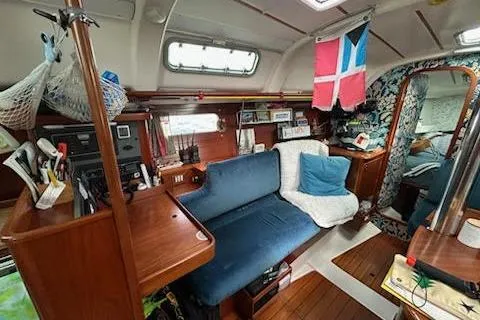 Slide: The Image of Interior of 1994 Beneteau Oceanis 351 sailboat with cozy seating and nautical decor. - 23