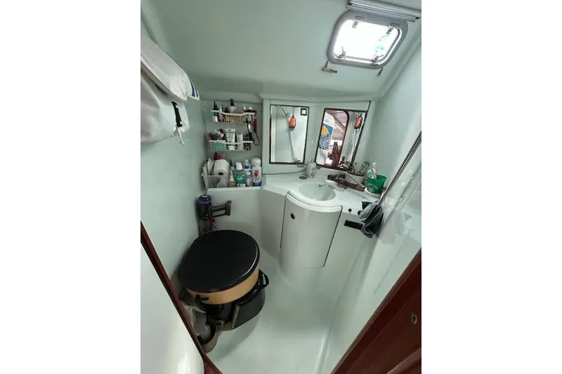 Slide: The Image of Bathroom interior of 1994 Beneteau Oceanis 351 sailboat, featuring compact design and amenities. - 30