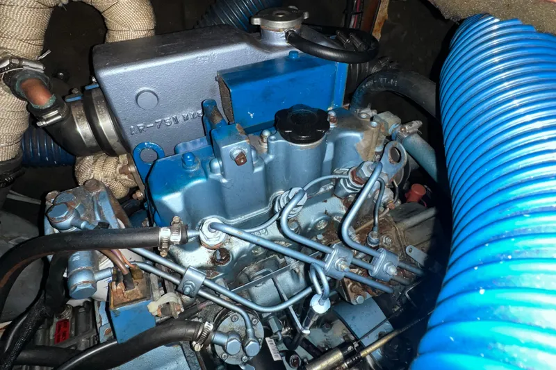 Slide: The Image of Engine of a 1994 Beneteau Oceanis 351 sailboat, showcasing mechanical components. - 31